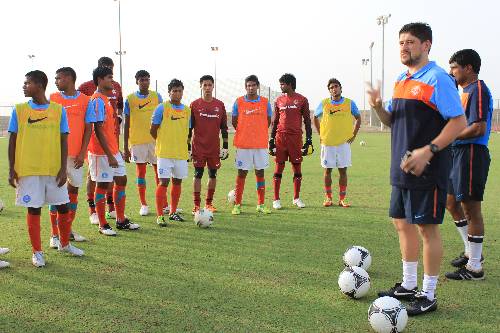 Optimized-Arthur Papas with the boys at the first training session in Muscat.