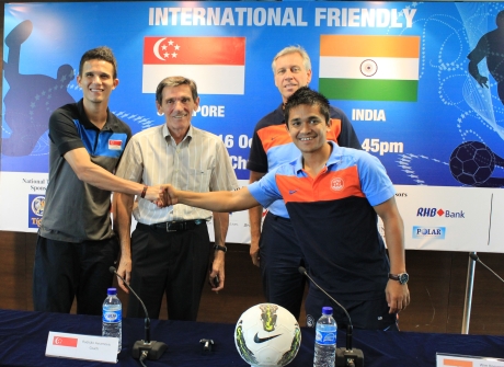 Baihakki Khaizan and Sunil Chhetri exchange pleasantries as Radojko Avramovic and Wim Koevermans look on