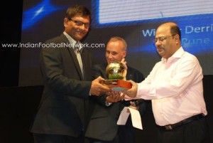 Derrick receiving the best coach award from Subrata Dutta and Joe Morrison